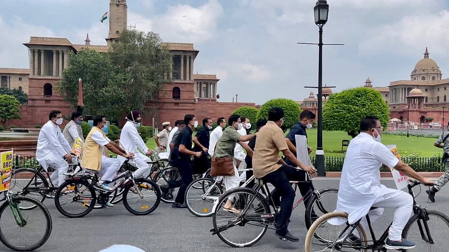 MPs including Gandhi took to cycling on Raisina Road to oppose hike in prices of petrol, diesel and cooking gas cylinders. Credit: Twitter/@RahulGandhi