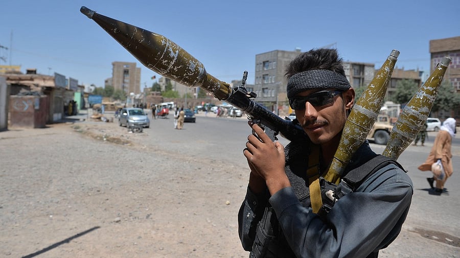 A policeman holds a rocket-propelled grenade (RPG) along a road in Herat on August 2, 2021. Credit: AFP Photo