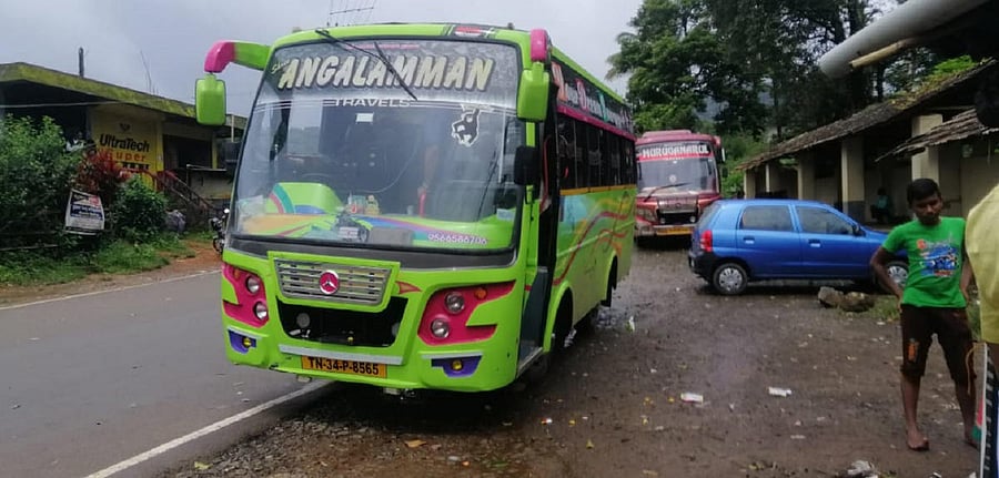 Tourists from Tamil Nadu arrive in Bhagamandala on a tourist bus.
