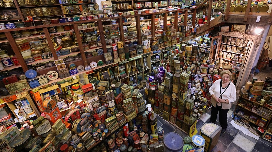 Yvette Dardenne, 83, from Belgium, stands among her vintage lithographed tin box collection. Credit: Reuters Photo