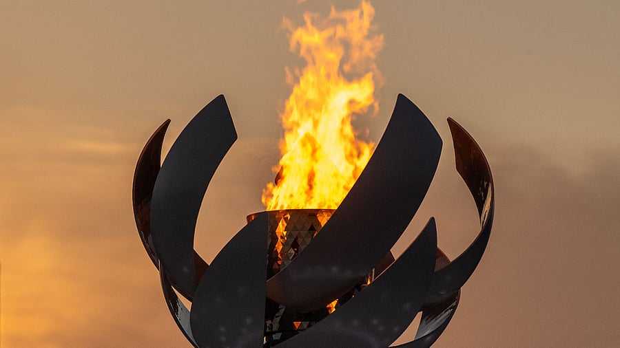 The Olympic flame is seen burning on the cauldron at Ariake Yume-no-Ohashi Bridge in Tokyo. Credit: AFP Photo