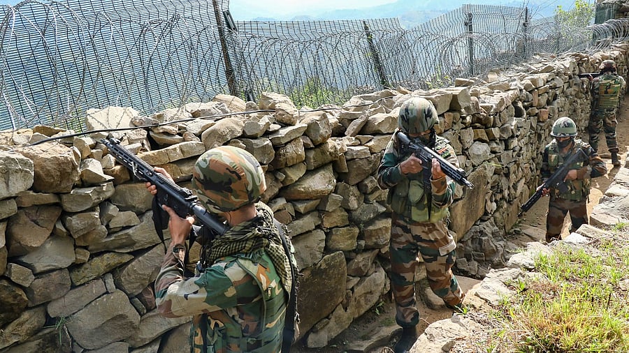 Indian army soldiers patrol along the Line of Control (LOC) between India and Pakistan border in Poonch district. Credit: PTI File Photo
