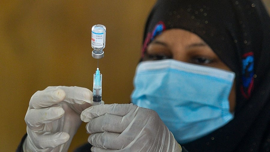 A health worker prepares a Covid jab. Credit: AFP photo