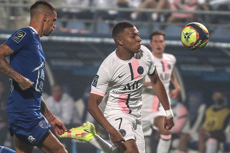 Paris Saint-Germain's French forward Kylian Mbappe eyes the ball during the French L1 football match between Paris Saint-Germain (PSG) and ES Troyes. Credit: AFP Photo