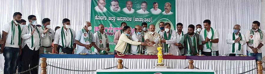 JD(S) state president H K Kumaraswamy inaugurates the party's district executive committee meeting held at Vokkaligara Samudaya Bhavana in Somwarpet on Monday.