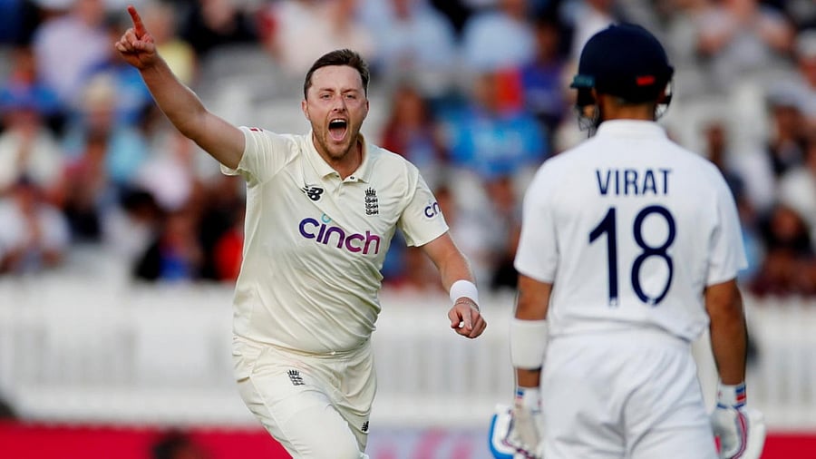 England's Ollie Robinson celebrates the wicket of India's Virat Kohli. Credit: Reuters Photo