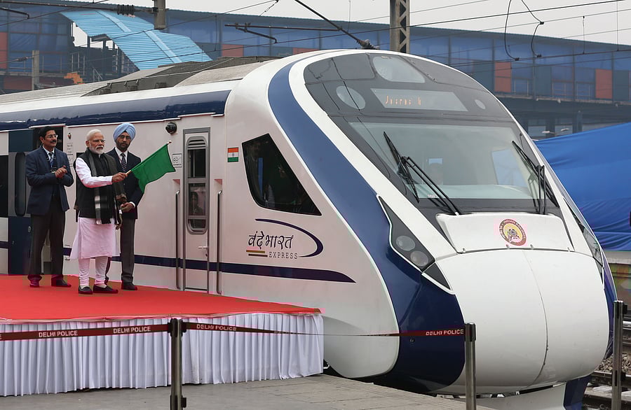 In this photo taken on February 15, 2019, Indian Prime Minister Narendra Modi (2nd L) flags off India's first semi-high speed express train Vande Bharat Express at New Delhi Railway Station.Credit: PTI
