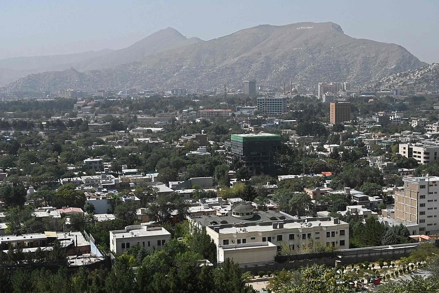 This picture taken from the top of a hillside shows a general view of the Kabul city. Credit: AFP Photo