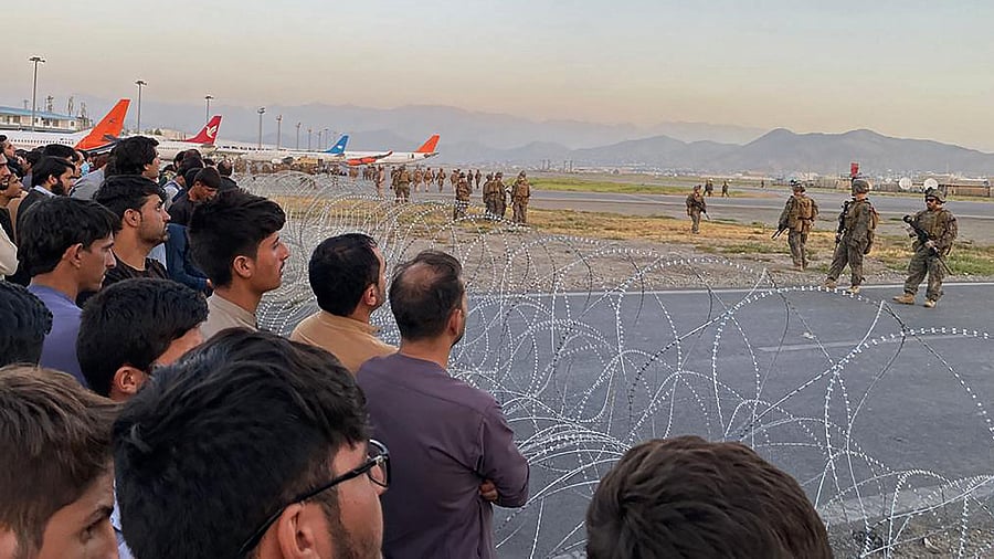 Afghan locals, worried about their future, asked returning Indians: "Where will we go? This is our motherland." Credit: AFP Photo