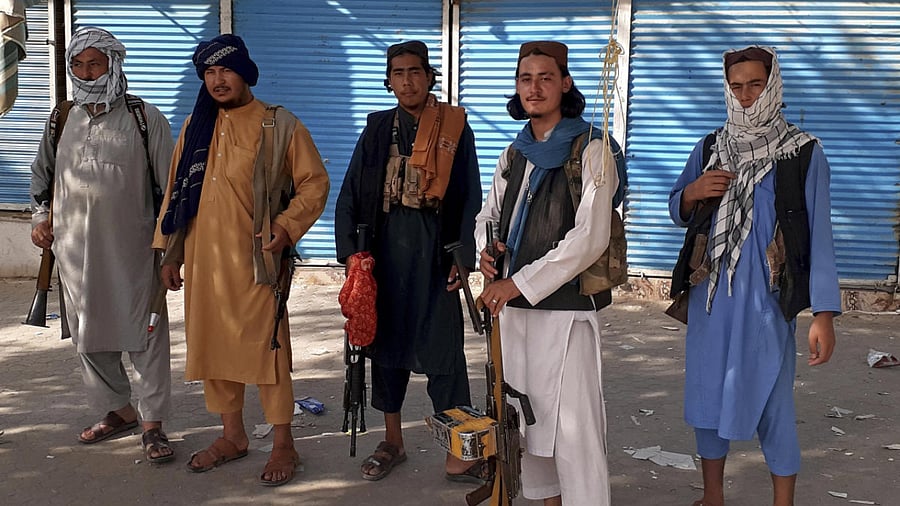 Taliban fighters stand guard in Kunduz city, northern Afghanistan. Credit: AP Photo