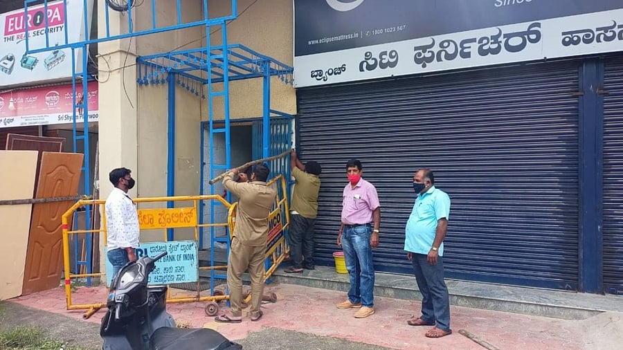 A building being sealed down by the authorities in Hassan. Credit: DH Photo