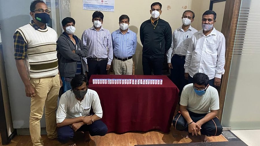 CEN Police in Belagavi with the two accused arrested for black marketing of black fungus medicine on Wednesday. Credit: City Police