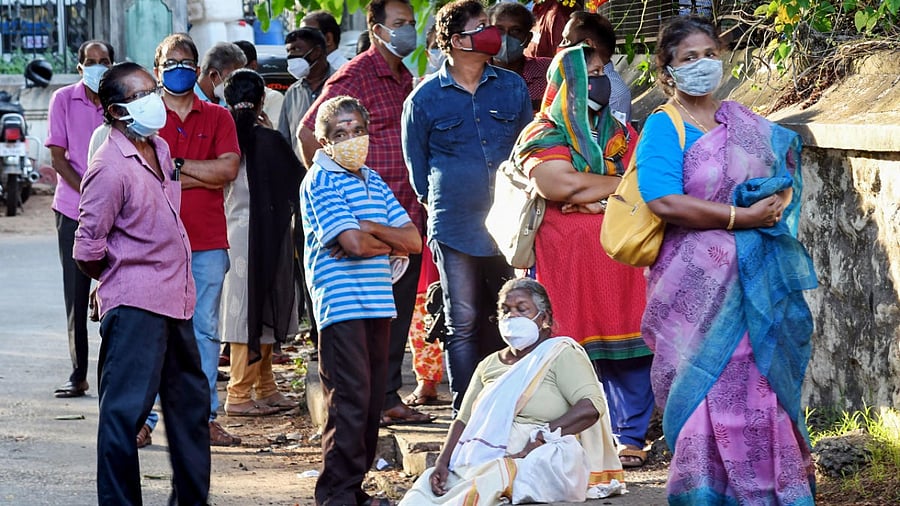 People wait to receive Covid-19 vaccine doses, outside a centre in Thiruvananthapuram. Credit: PTI Photo