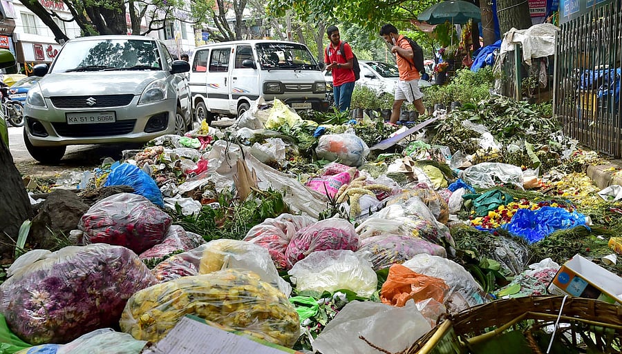 Garbage left uncleared along the road at Gandhi Bazar. DH FILE/Ranju P