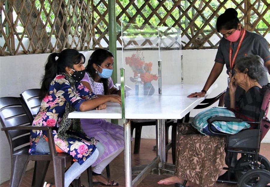 At Nightingales Centre for Ageing and Alzheimer’s, Kasturinagar, vistors are restricted. The lounge has tables fitted with transparent partition screens.