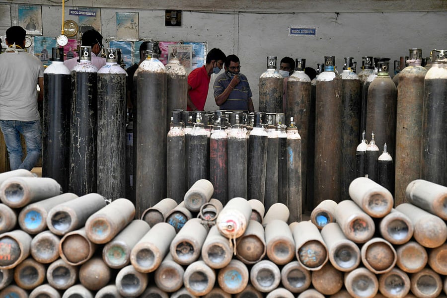 With hospitals beds being scarce, voluntary groups were delivering oxygen cylinders to patients in home isolation. DH Photo Pushkar V. Picture for representation.