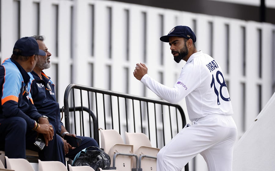 Skipper Virat Kohli in an animated chat with Head Coach Ravi Shastri (left) and bowling coach Bharat Arun during India's practice session in Southampton on Thursday. Credit: Reuters