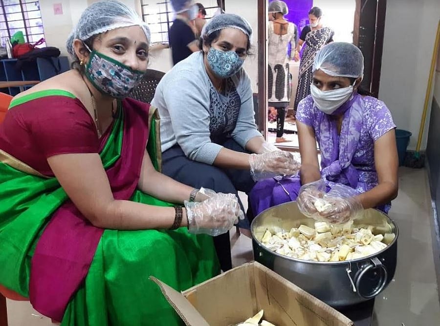 Staff members of Ambika Group of Institutions preparing chips. Credit: DH Photo