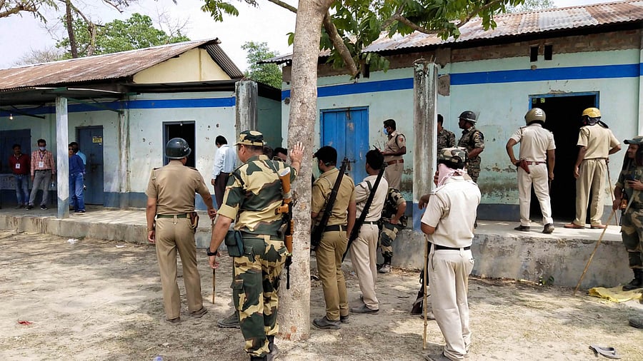 Security personnel keep vigil at a polling station after Election Commission ordered of stopping the voting exercise at polling station number 126 in Sitalkuchi, where clashes erupted between locals and central forces. Credit: PTI File Photo