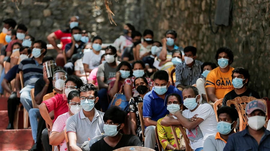 People wait to receive their doses of Sinopharm vaccine against the coronavirus disease (Covid-19) in Colombo, Sri Lanka August 20, 2021. Credit: Reuters Photo