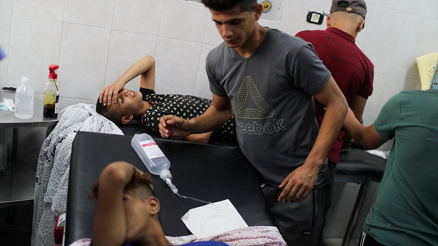 Wounded Palestinians lie in hospital beds after taking part in a protest at Israel-Gaza border east of Gaza City. Credit: Reuters photo