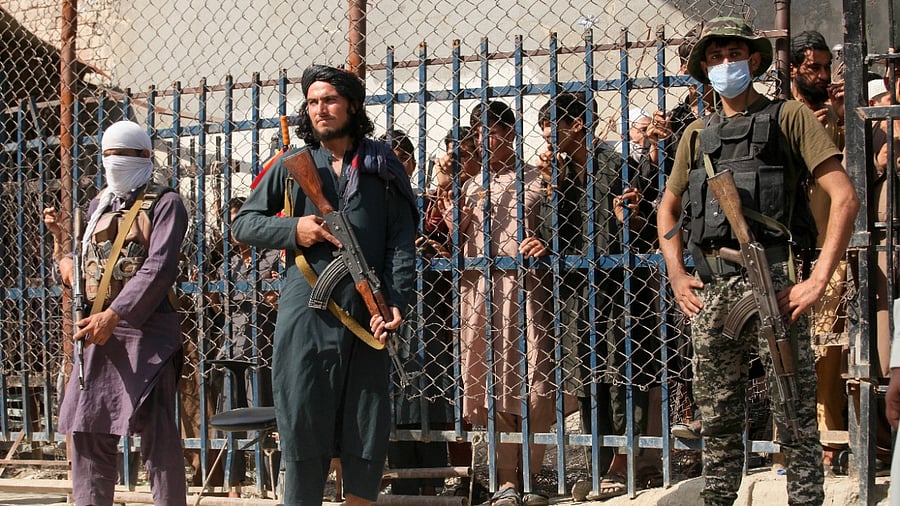 In the current situation in Afghanistan, pedestrian movement is limited at the Torkham border, with only stranded people on both sides and trucks taking goods to Afghanistan passing through this border point. Credit: AP/PTI Photo