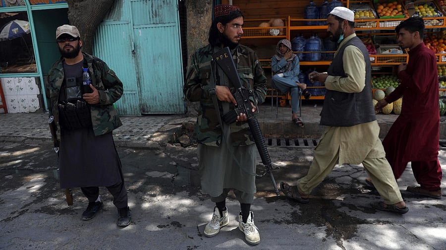 Taliban fighters stand guard at a checkpoint in the Wazir Akbar Khan neighborhood in the city of Kabul, Afghanistan. Credit: AP/PTI Photo