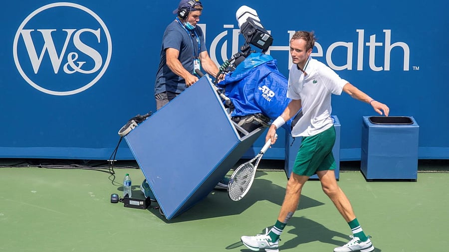 Daniil Medvedev (RUS) runs into the tv camera during his match against Andrey Rublev (RUS not pictured) in their semi-final match during the Western and Southern Open at the Lindner Family Tennis Center. Credit: USA Today Sports