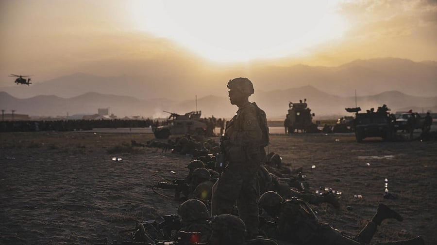 US Army Soldiers assigned to the 10th Mountain Division standing security at Hamid Karzai International Airport, Kabul, Afghanistan. Credit: AFP Photo