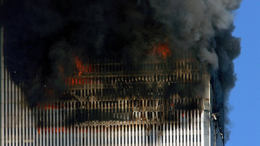 Smoke & flames billow out of the twin towers of the World Trade Center before their collapse in lower Manhattan, New York on September 11, 2001. Credit: AFP File Photo