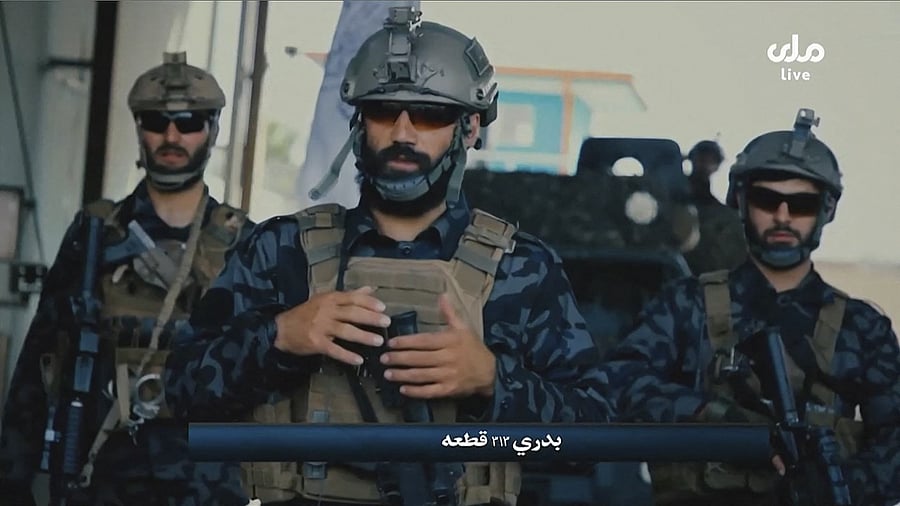 A video grab taken from Afghan TV RTA shows propaganda images of Taliban's Badri 313 Special Forces patrolling streets in an unidentified location in Afghanistan. Credit: AFP Photo