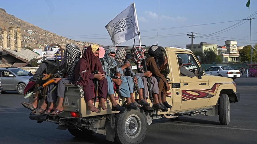 Taliban fighters in a vehicle patrol the streets of Kabul. Credit: AFP Photo