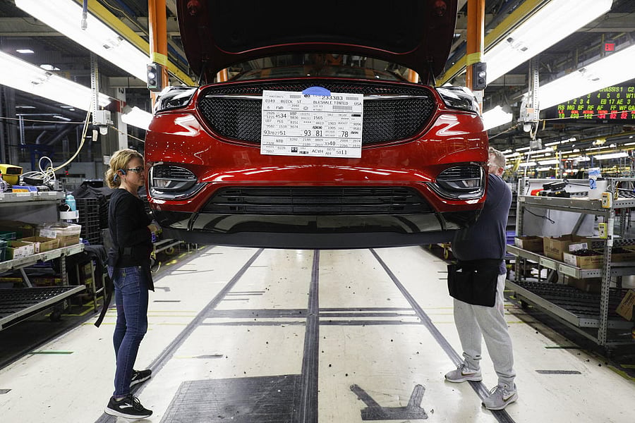 General Motors Chevrolet Traverse and Buick Enclave vehicles go through the assembly line at the General Motors Lansing Delta Township Assembly Plant on February 21, 2020, in Lansing, Michigan. In recent weeks, Nissan Motor Co. and General Motors Co. both warned the component shortage is exacerbating due to the lockdowns in Malaysia, with the Japanese carmaker shutting the production lines at its Smyrna, Tennessee, facility for two weeks in August. AFP file photo