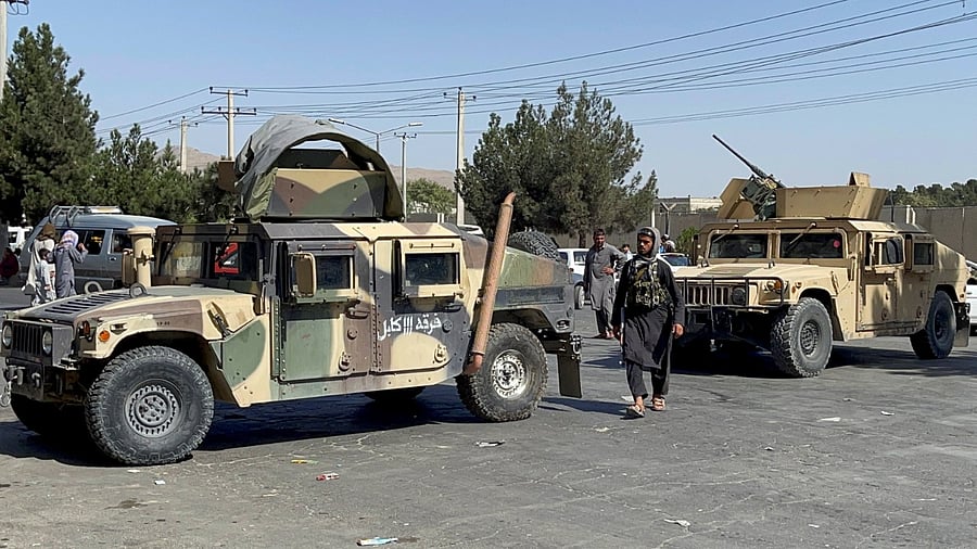 Taliban forces block the roads around the airport in Kabul. Credit: Reuters Photo