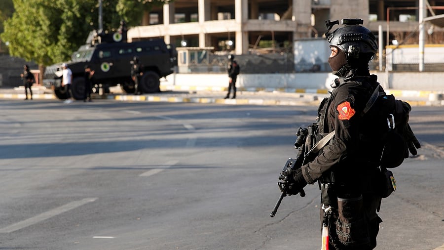 Members of the Iraqi security forces stand guard to implement security measures ahead of the Baghdad Summit in Baghdad. Credit: Reuters Photo