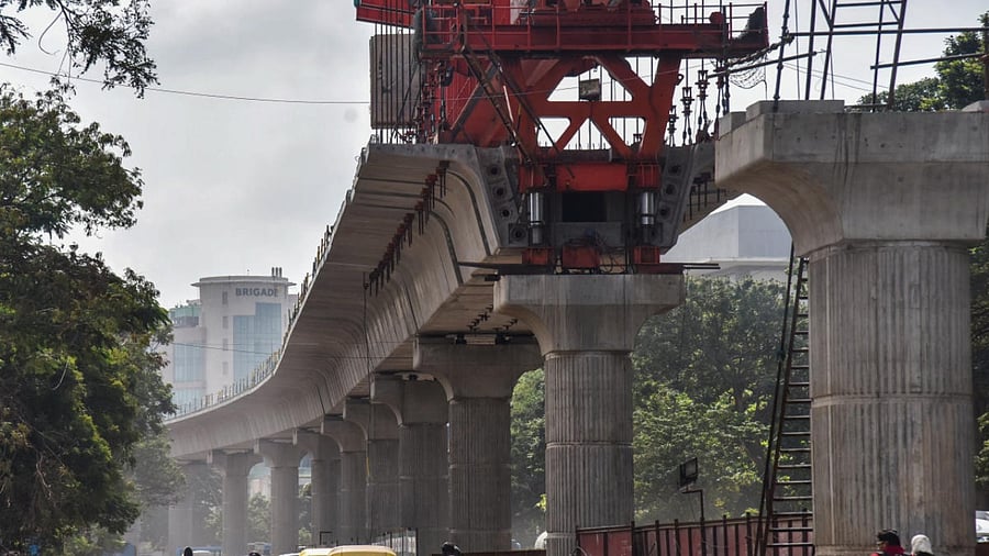 Namma Metro rail construction work is going on at Whitefield road, ITPL in Bengaluru on Thursday. Credit: DH Photo/S K Dinesh