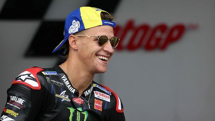 Yamaha French rider Fabio Quartararo celebrates winning the MotoGP race of the motorcycling British Grand Prix at Silverstone circuit. Credit: AFP Photo