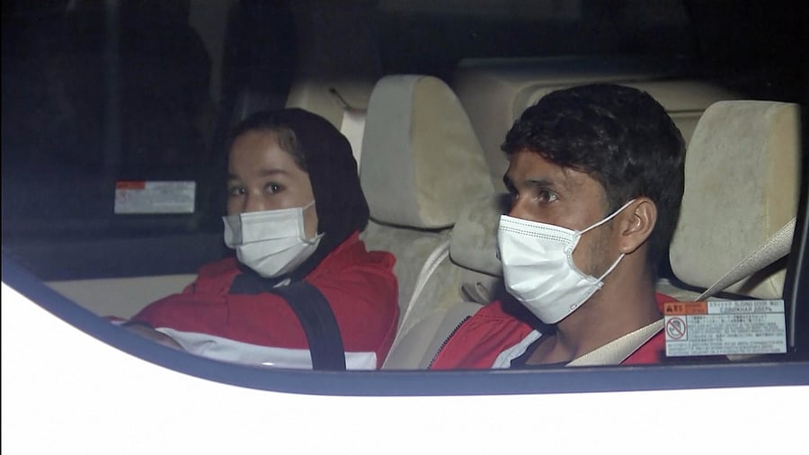 Afghan athletes Zakia Khudadadi (left) and Hossain Rasouli arrive at Haneda airport in Tokyo. Credit: AP/PTI Photo