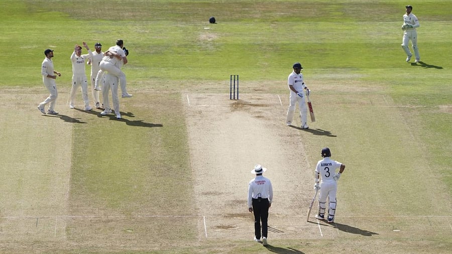 England players celebrate the wicket of Virat Kohli in third Test at Headingley. Credit: AP Photo