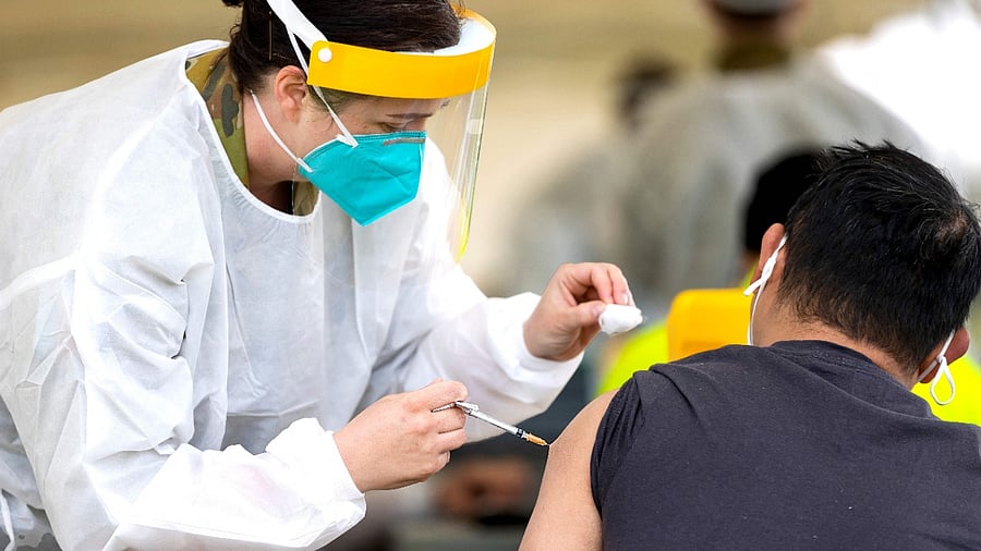 Australia Army Medical Officer Major Bethan Ganderton administers a Covid-19 vaccine at the Dubbo Mass Vaccination centre in Dubbo. Credit: AFP Photo/Australian Defence Force