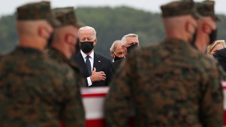US President Joe Biden salutes during the dignified transfer of the remains of US Military service members who were killed by a suicide bombing at the Hamid Karzai International Airport. Credit: Reuters photo