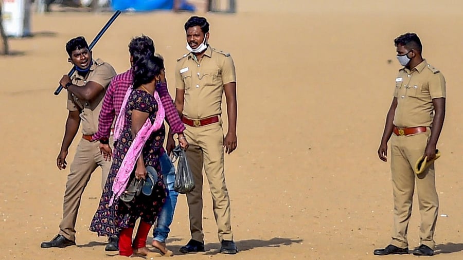 File Photo of police enforcing Covid-19 restrictions at Marina beach in Chennai. Credit: PTI Photo