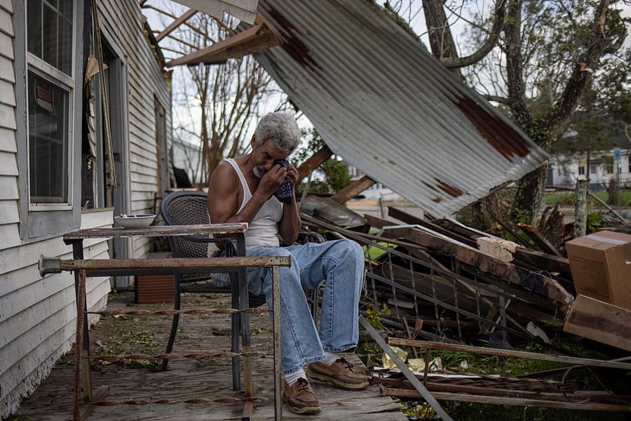 Theophilus Charles, 70, weeps while sitting on the front porch of his heavily damaged home in the aftermath of Hurricane Ida in Houma, Louisiana. Credit: Reuters Photo