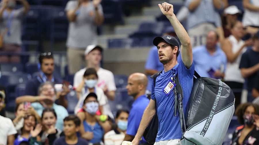 Andy Murray of United Kingdom waves to the crowd after losing to Stefanos Tsitsipas of Greece during their men's singles first round match on Day One of the 2021 US Open at the Billie Jean King National Tennis Center on August 30, 2021 in the Flushing neighborhood of the Queens borough of New York City. Credit: AFP Photo