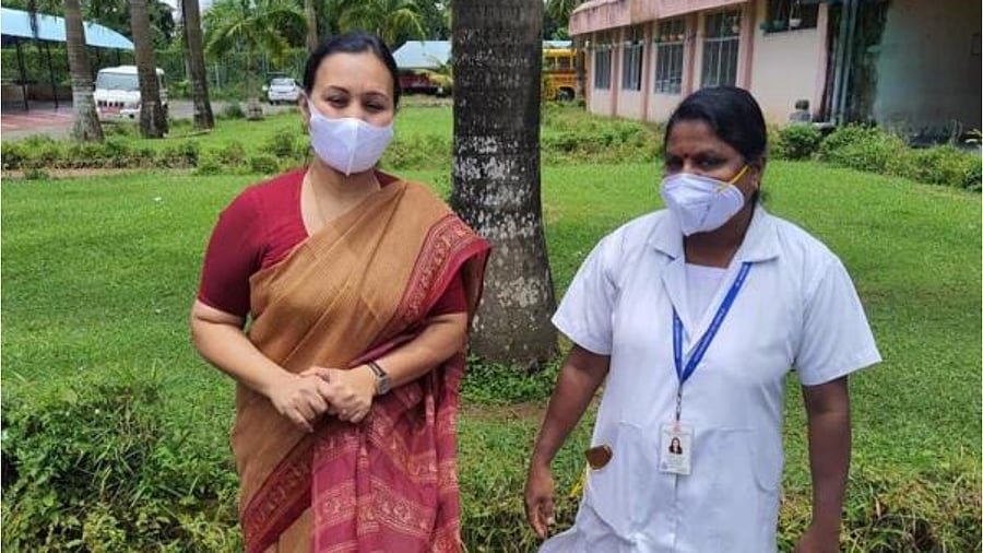 <div class="paragraphs"><p>Kerala Health Minister Veena George with a health worker. </p></div>