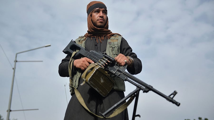 A Taliban fighter attends a rally in Kabul on August 31, 2021 as they celebrate after the US pulled all its troops out of the country to end a brutal 20-year war -- one that started and ended with the hardline Islamist in power. Credit: AFP Photo