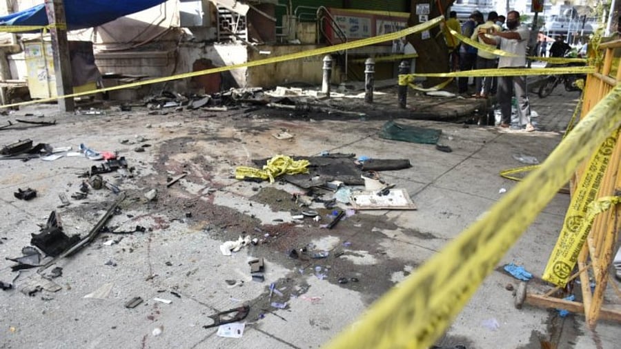 The police said that the SUV, being driven by one of the deceased, was crushed after the driver lost control, hit a pole and then rammed into a building near Mangala Convention Hall. Credit: DH Photo