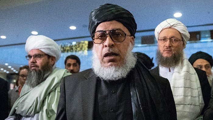Taliban political chief Sher Mohammad Abbas Stanikzai (center). Credit: AP Photo