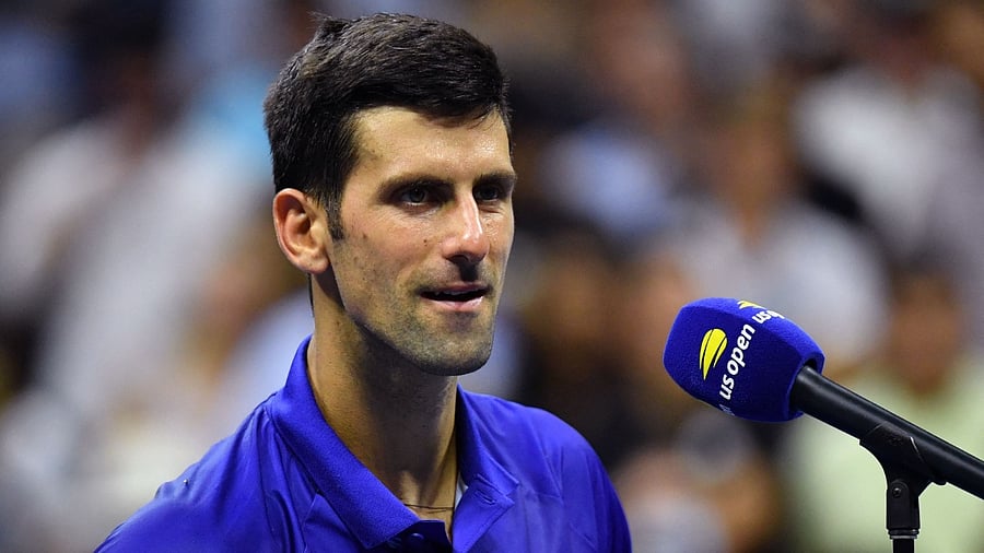 Serbia's Novak Djokovic speaks on the court after winning his 2021 US Open Tennis tournament men's singles first round match against Denmark's Holger Rune at the USTA Billie Jean King National Tennis Center in New York, on August 31, 2021. Credit: AFP Photo