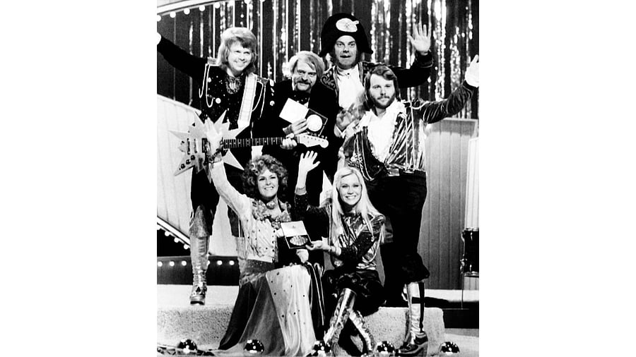 ABBA  hold the trophy as they celebrate on stage after winning the final of the Eurovision Song Contest 1974. Credit: AFP File Photo